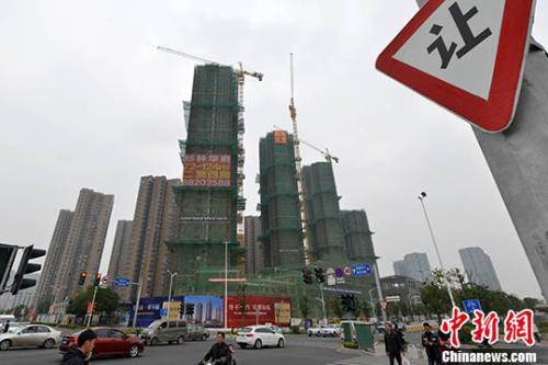 资料图：商品房在建中。 <a target='_blank' href='http://www.chinanews.com/' _fcksavedurl='http://www.chinanews.com/'></table>中新社</a>记者 吕明 摄